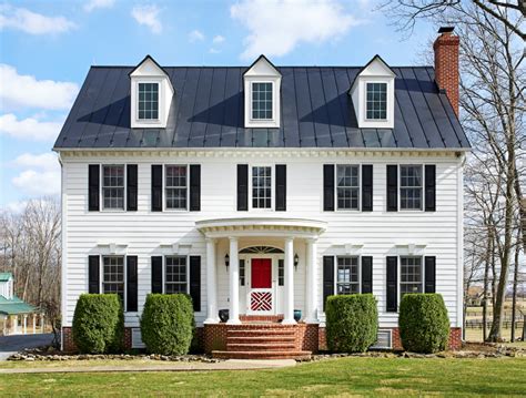 white colonial house with metal roof|1920 era metal roofing.